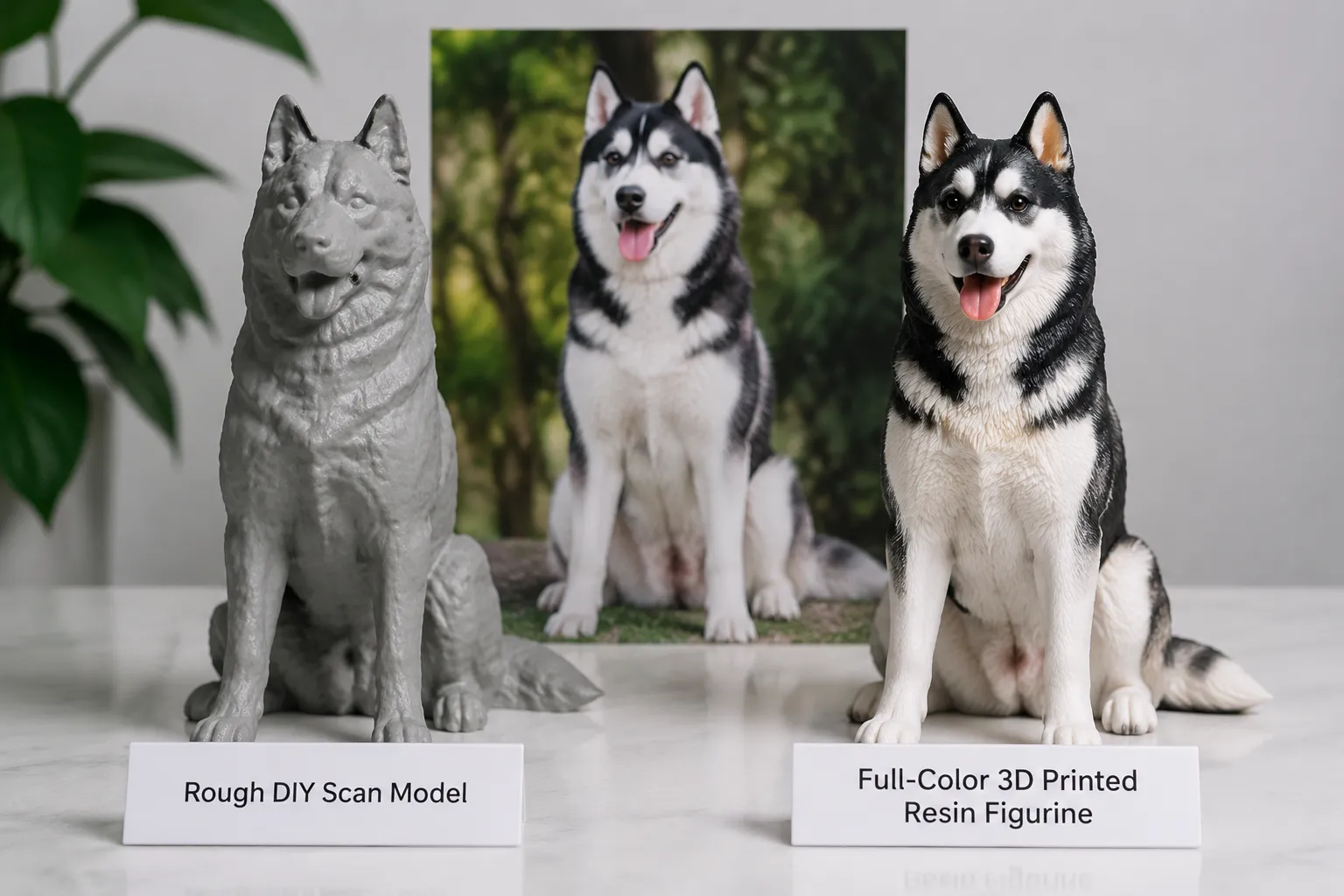 A rough DIY scan model beside a polished resin Husky figurine with the real Husky's photo behind on a desk