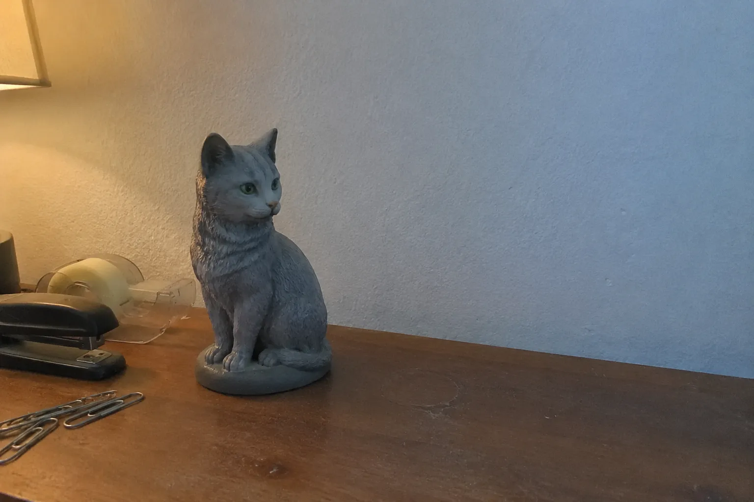 Full-color resin figurine of a Russian Blue cat sitting poised and calm